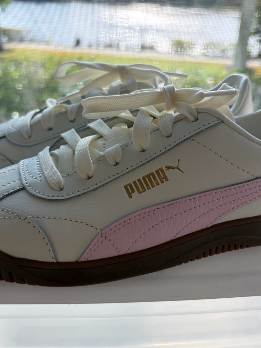 Puma White Sneakers with Pink Stripe and Gold Logo